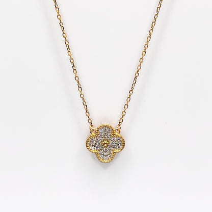 Gold four-leaf clover pendant necklace with glittery charm on chain