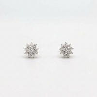 Sterling silver starburst stud earrings, front view pair