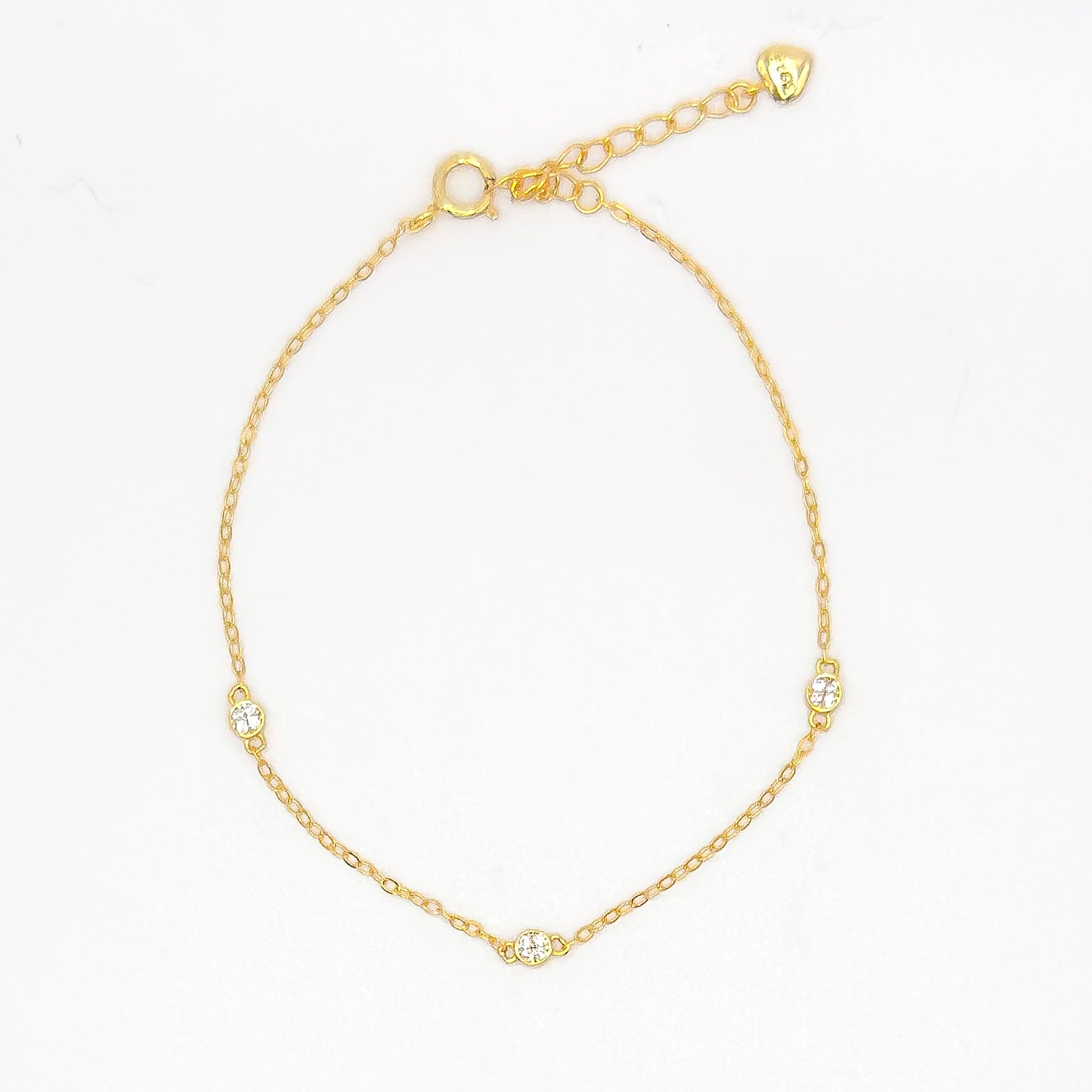 Gold-tone CZ trio bracelet with three small round stones and a small clasp