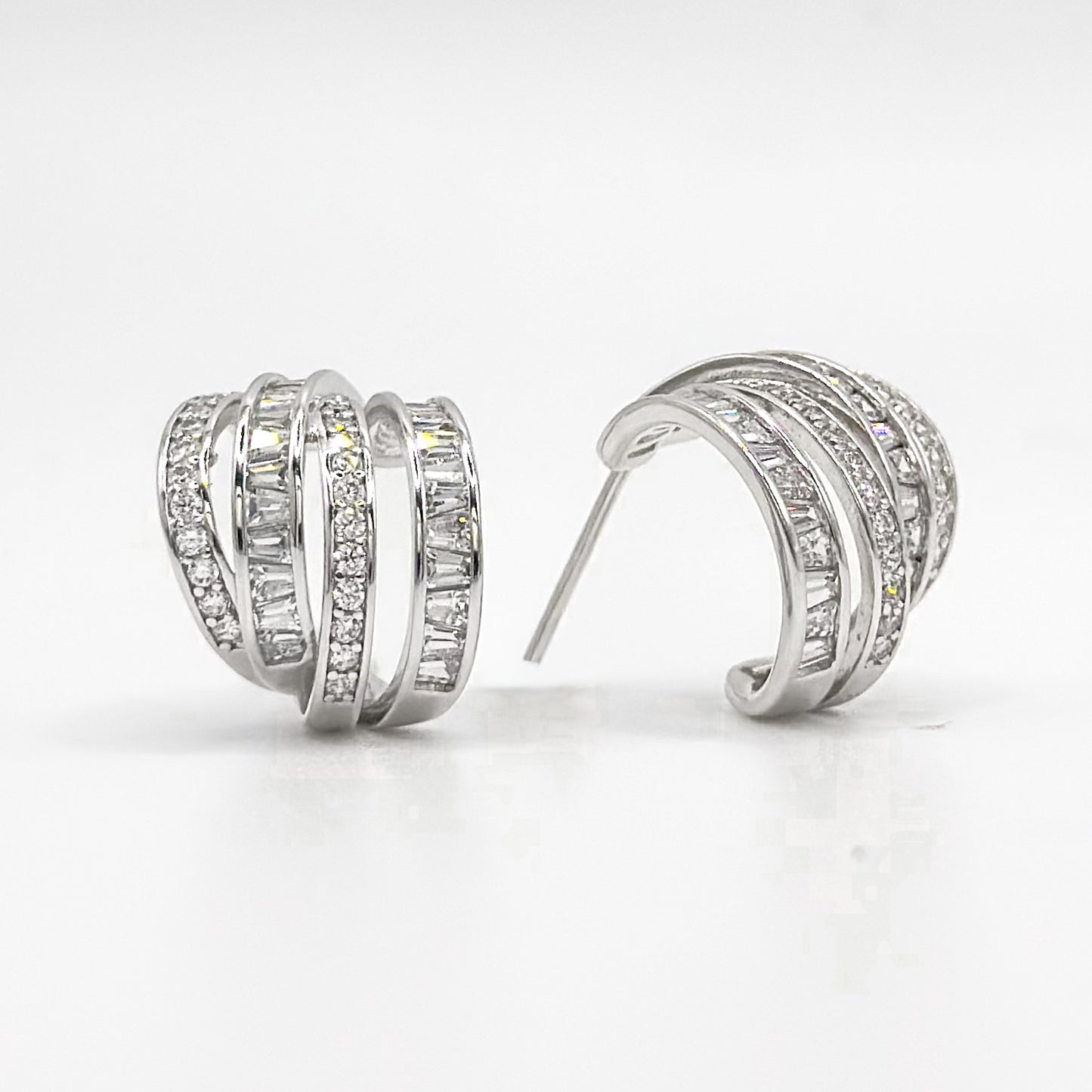Chunky sterling silver half hoop earrings with pavé crystal rows