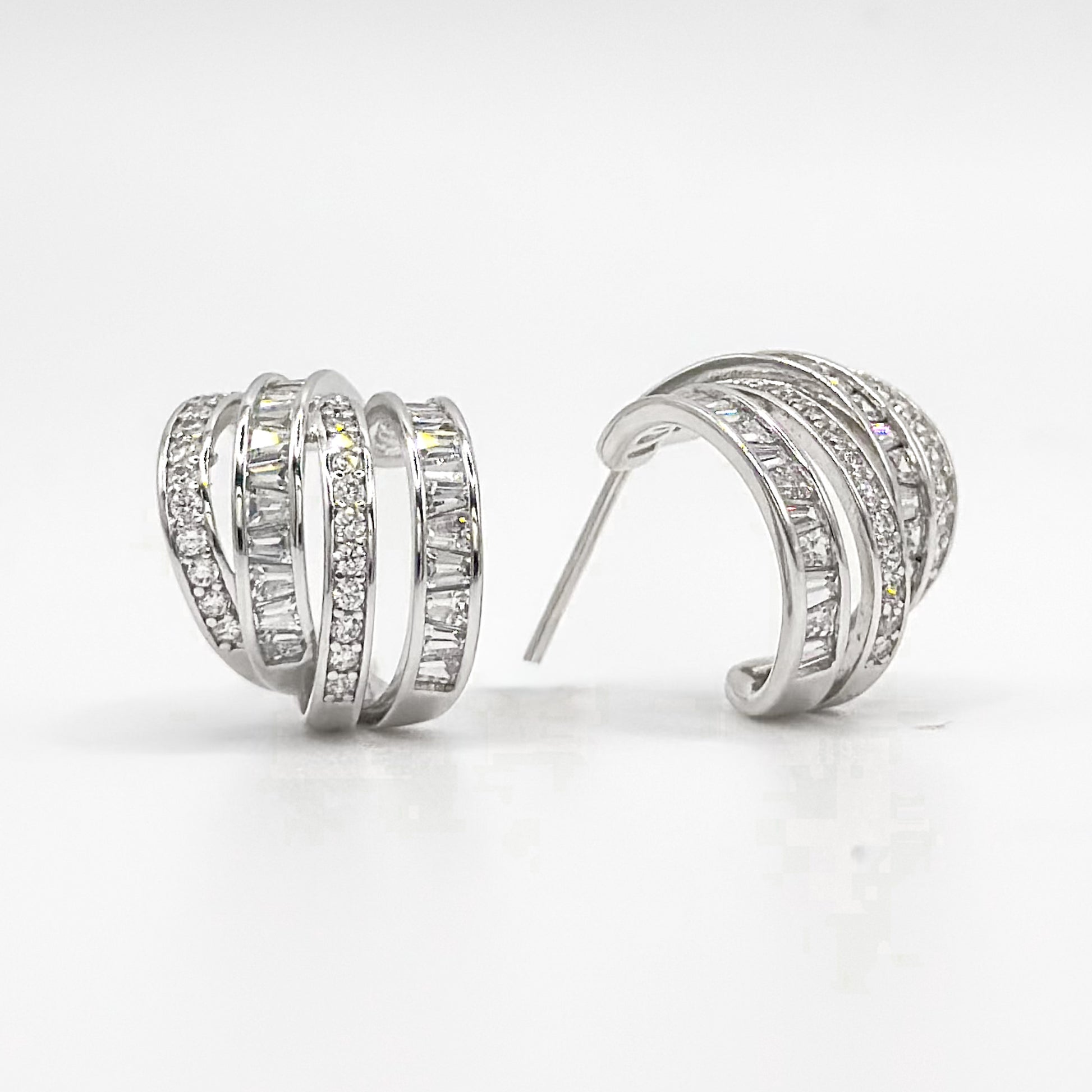 Chunky sterling silver half hoop earrings with pavé crystal rows