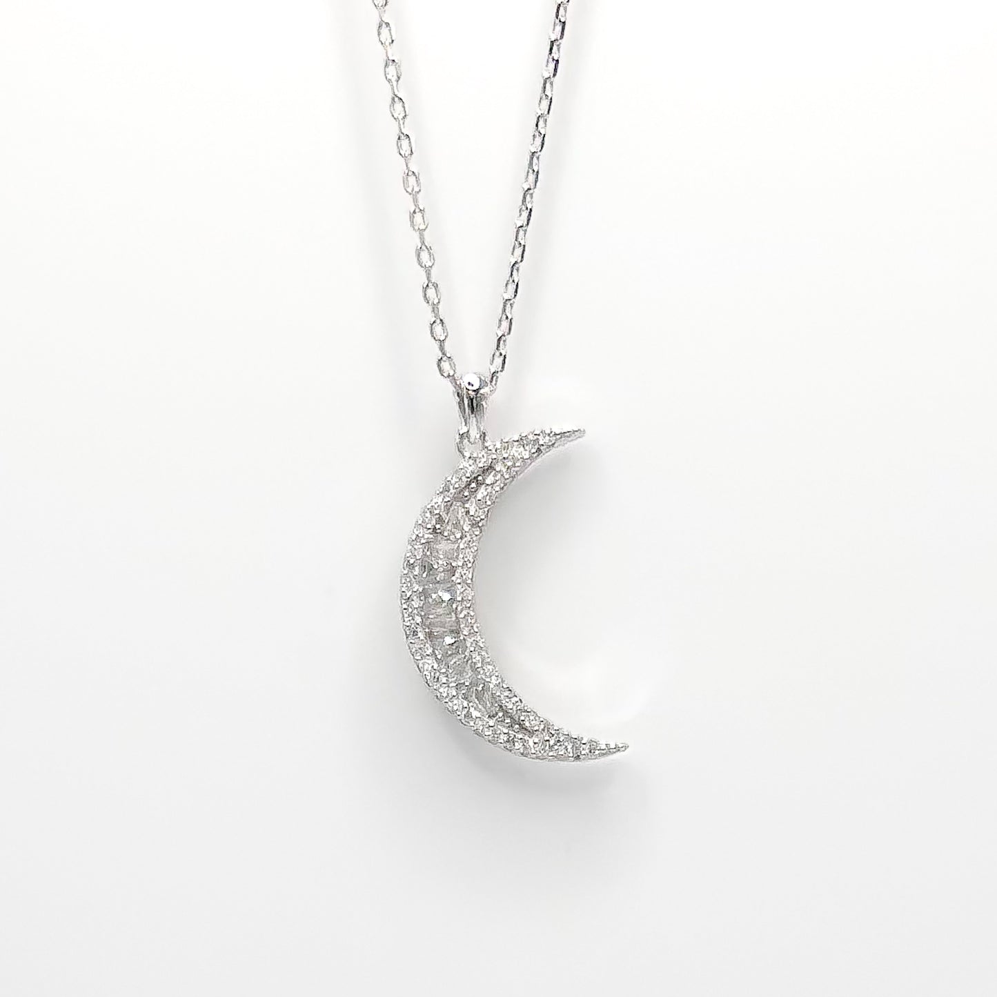 Silver crescent moon pendant necklace with sparkling pave details and chain