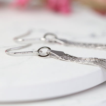 Silver tassel fringe earring hook with circular ring and dangling chain tassel