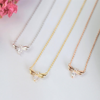 Firefly bracelet charm with gold-tone chain and dangling crystal bow