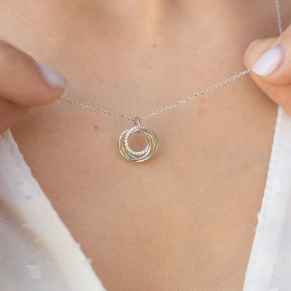 Silver-tone chain with multitone 4-ring pendant necklace, circular stacked rings charm