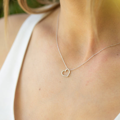 Silver open heart pendant necklace with heart charm on a thin chain