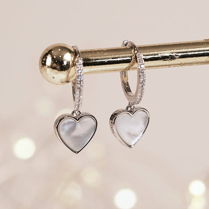 Silver heart drop earrings with white iridescent heart pendants and rhinestone hoops
