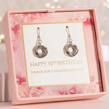 Silver hoop earrings with layered ring swirl dangles