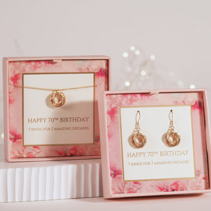 Gold-tone ring pendant necklace set, chain with circular triple-ring charm in box