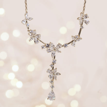 Silver bridal crystal floral necklace with starburst links and teardrop drop pendant
