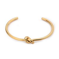 Gold knot bangle bracelet with twisted knot centerpiece, open cuff