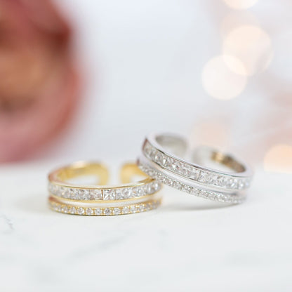 Gold and sterling silver adjustable rings with clear pave stones, pair view
