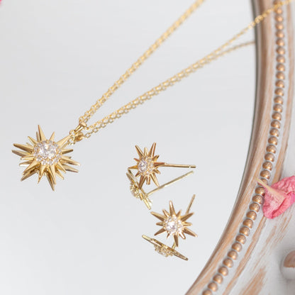 Gold starburst pendant necklace with matching starburst stud earrings