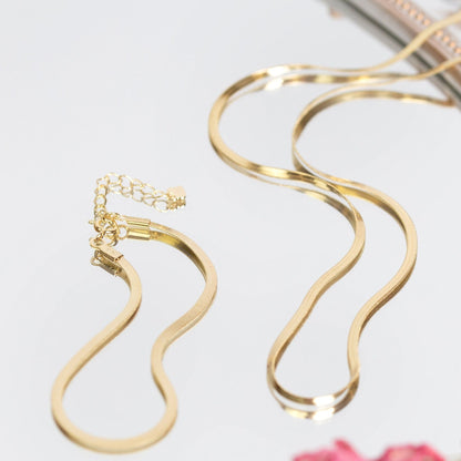 Snake chain necklace in gold tone, with small link pattern and clasp detail