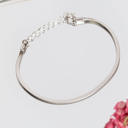 Silver flat snake chain bracelet with lobster clasp, laid out flat