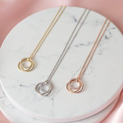 21st birthday necklace set with ring pendants in gold, silver, and rose gold