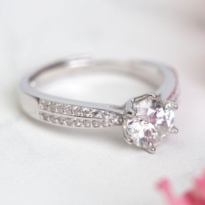 Silver lab-grown diamond ring with oval center stone and slim pave band