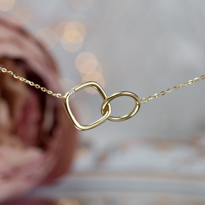 Gold infinity circle and square necklace with linked circle and square pendant