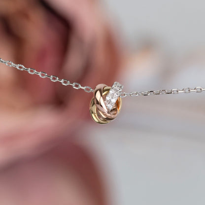 Silver chain mixed-metal knot necklace with oval pavé centerpiece