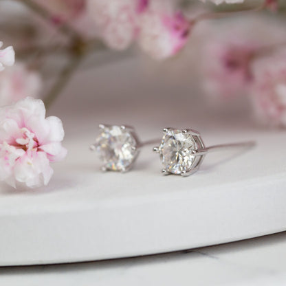 Round lab-grown diamond stud earrings in four-prong setting, white metal, pair