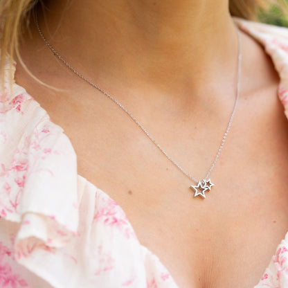 Silver star necklace with two small star pendants on a thin chain