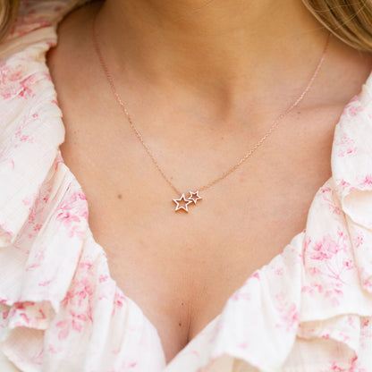 Silver star necklace with two star pendants on a thin chain