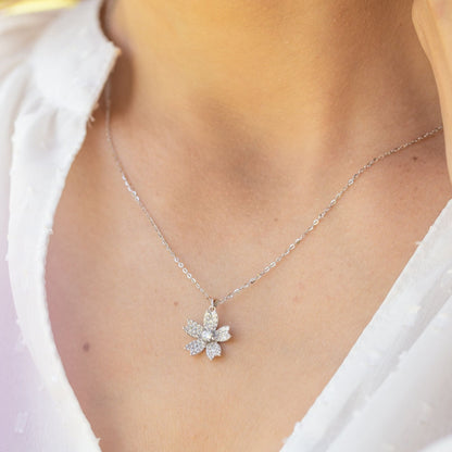 Sterling silver flower pendant necklace with pavé petal design at center