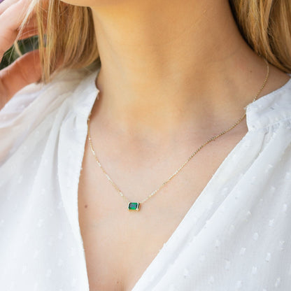 Gold emerald pendant necklace with square green gemstone pendant
