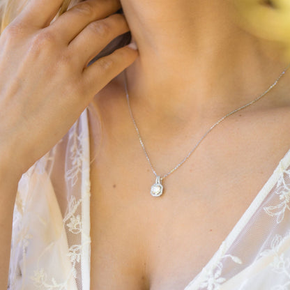 Lab-grown moissanite pendant necklace, round pendant with halo, silver chain on neckline