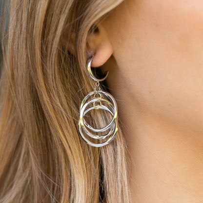 Silver hoop drop earrings with layered circular rings