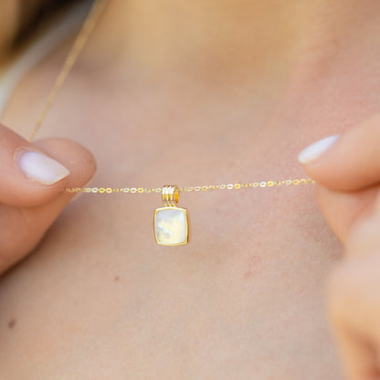 Square mother-of-pearl pendant necklace on delicate gold chain with ribbed connector