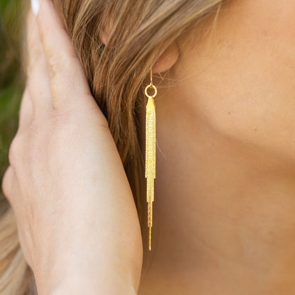 Gold tassel fringe earring with circular top and long dangling chain strands
