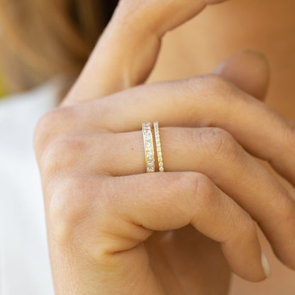 Stacked adjustable rings with clear pave stones in gold and silver
